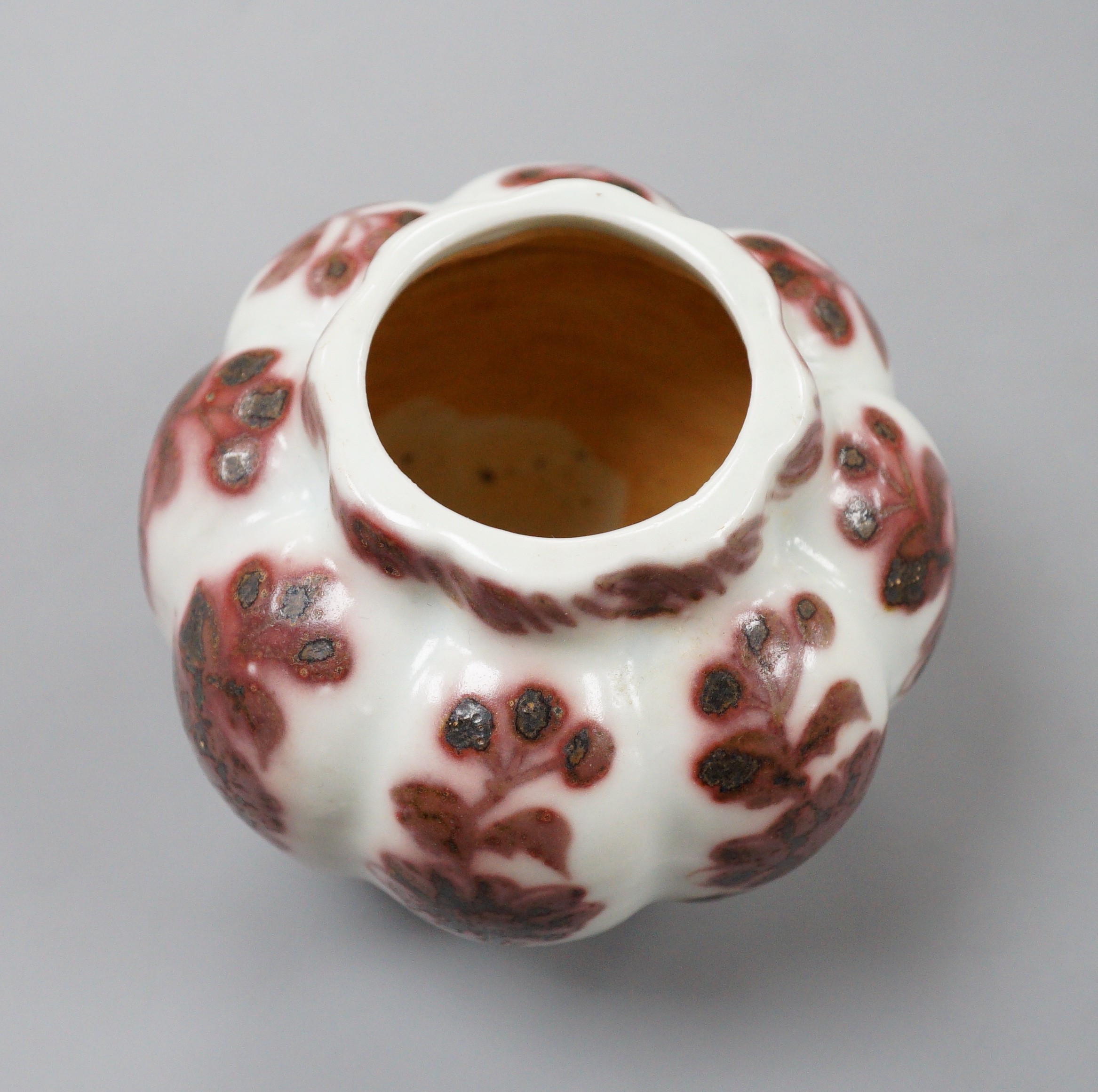 A Chinese underglaze copper red lobed jar, 9cm tall